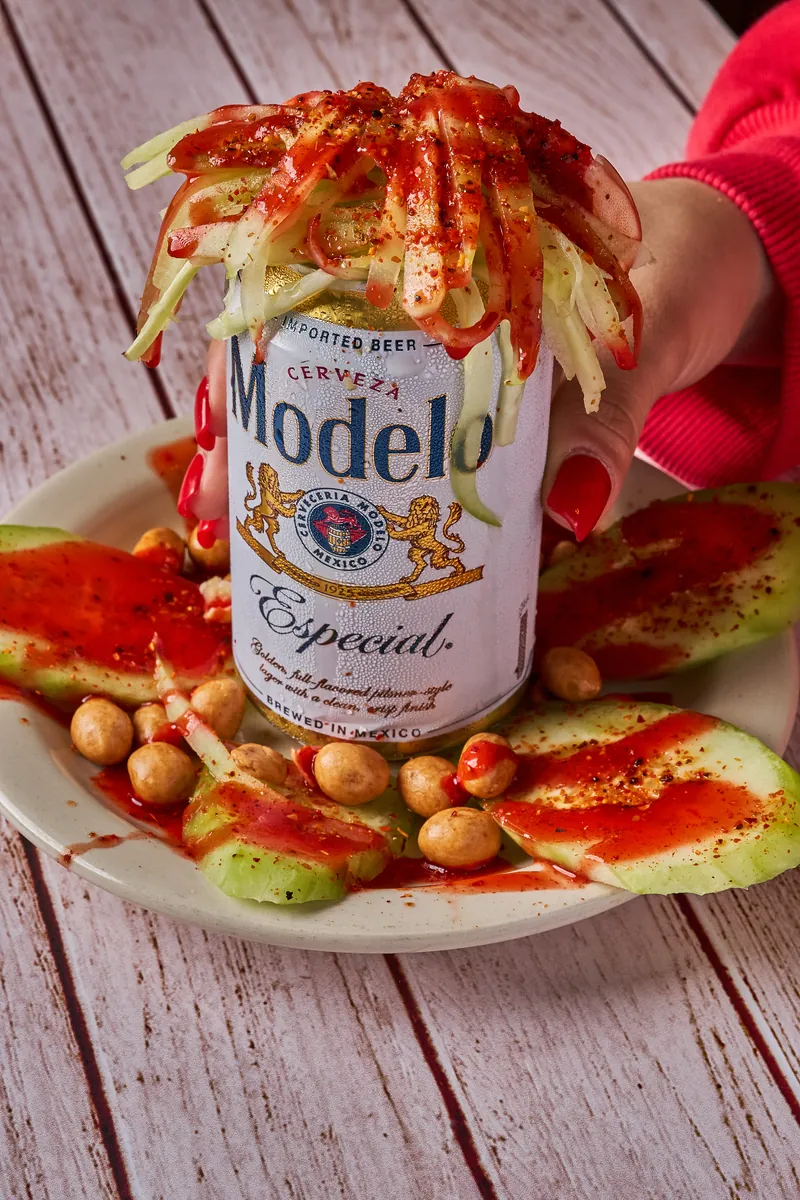 Michelada built around a Modelo with cucumber and chickpeas