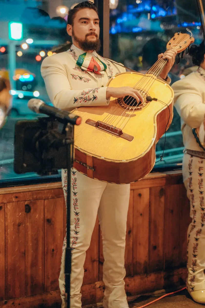 Mariachi guitarist waiting to play