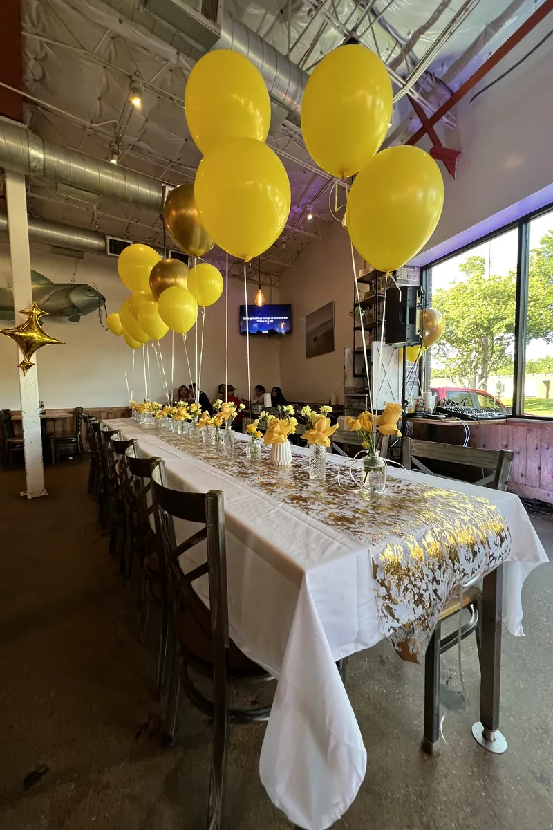Long table set with balloons for a private party