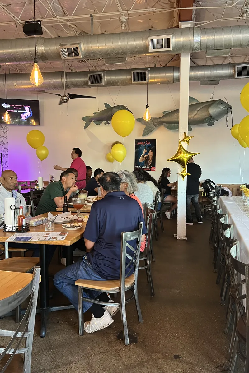 Dining room filled with guests under the marlin mounts