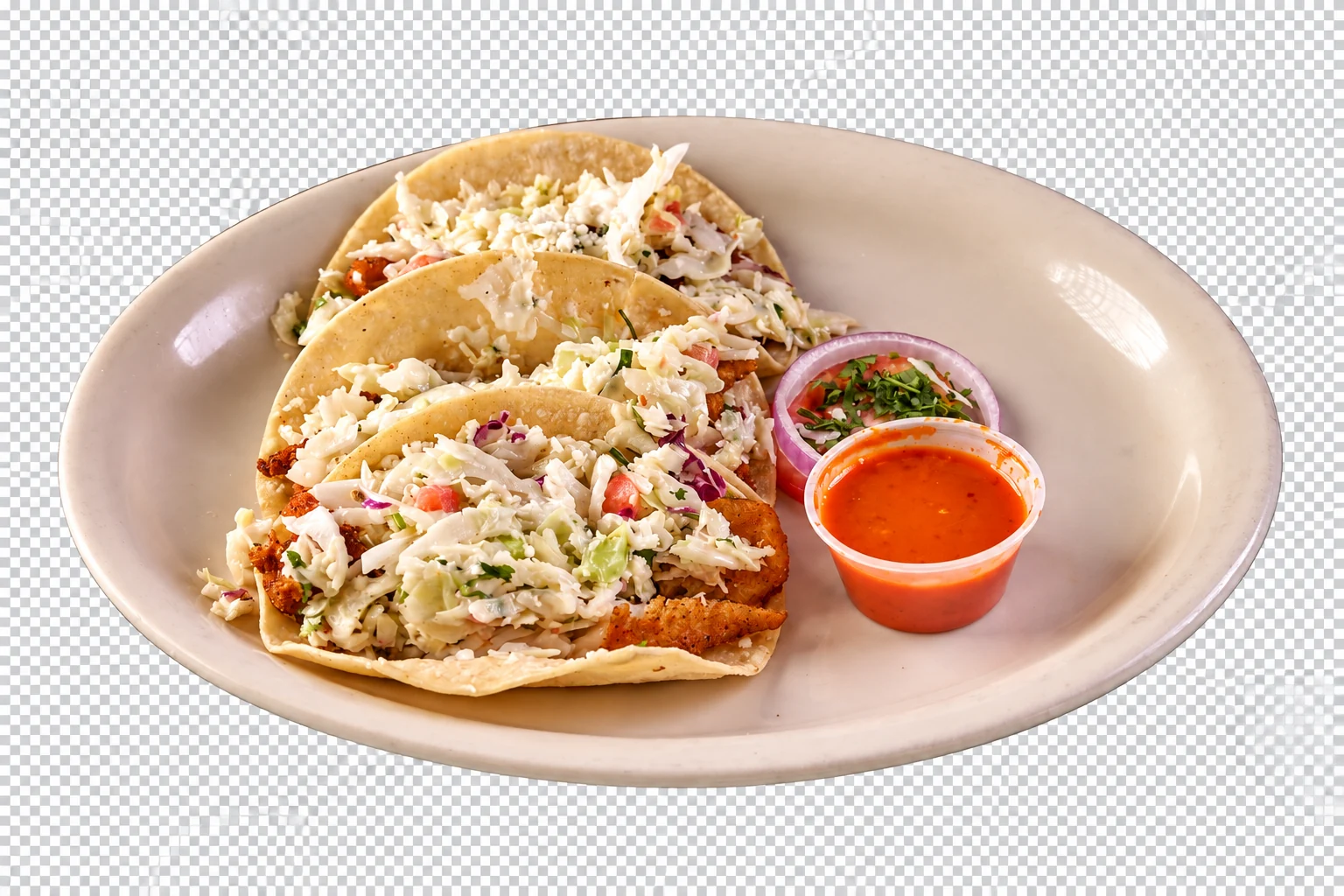 Our fish tacos with fresh slaw and salsa, served on an oval plate