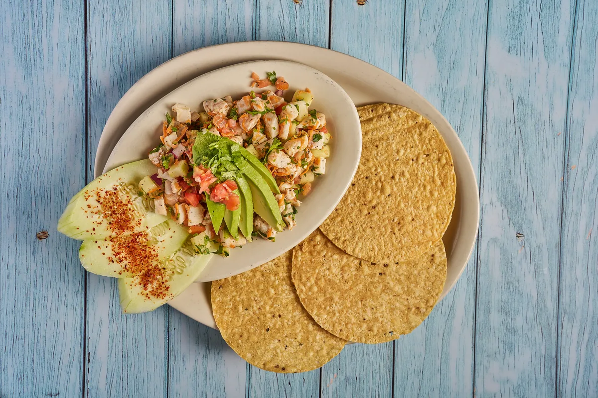 Ceviche tostada plate with avocado and cucumber